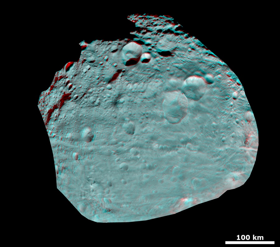 Der Asteroid Vesta ist als Anaglyphe dargestellt. Der Himmelskörper ist von vielen Kratern übersät.
